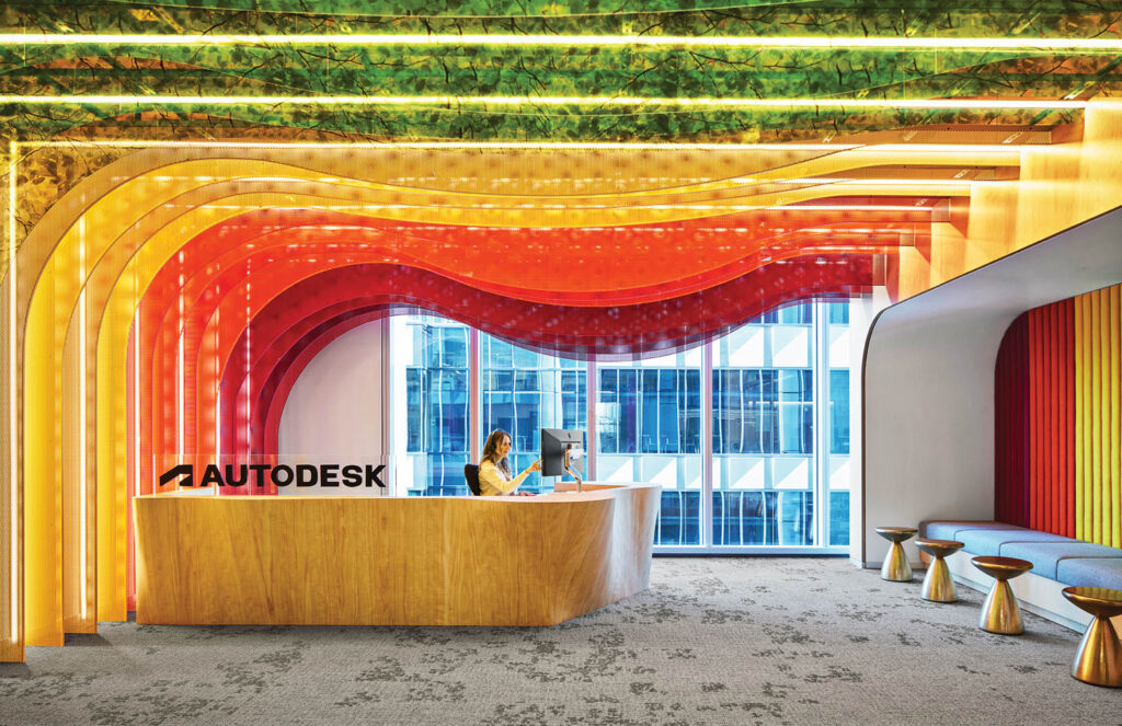 a rainbow colored celing installation in front of reception in Autodesk Atlanta