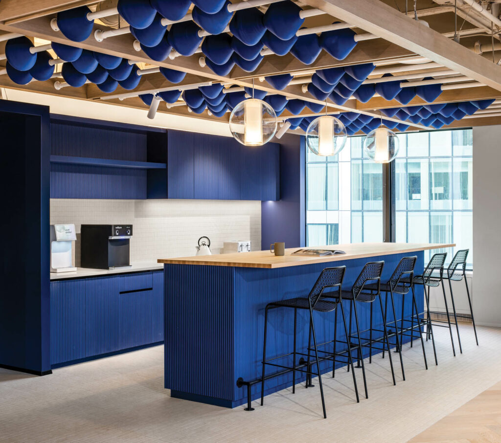 blue beads hang above the communal kitchen