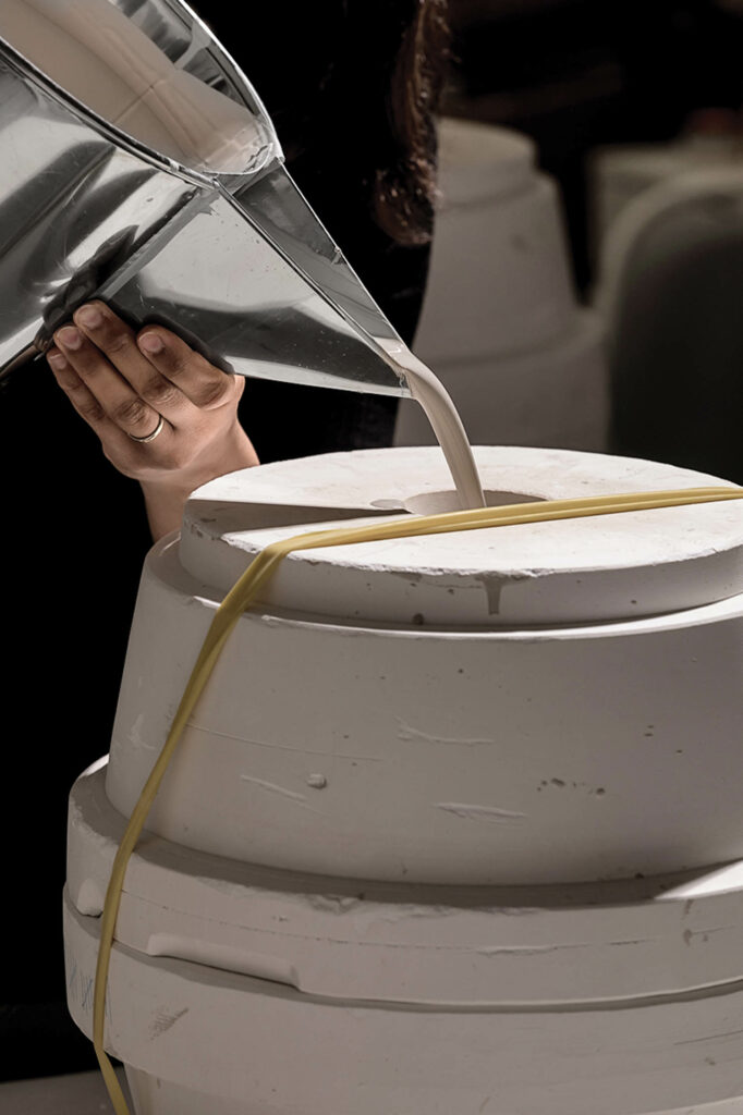 glaze being poured onto a ceramic disk