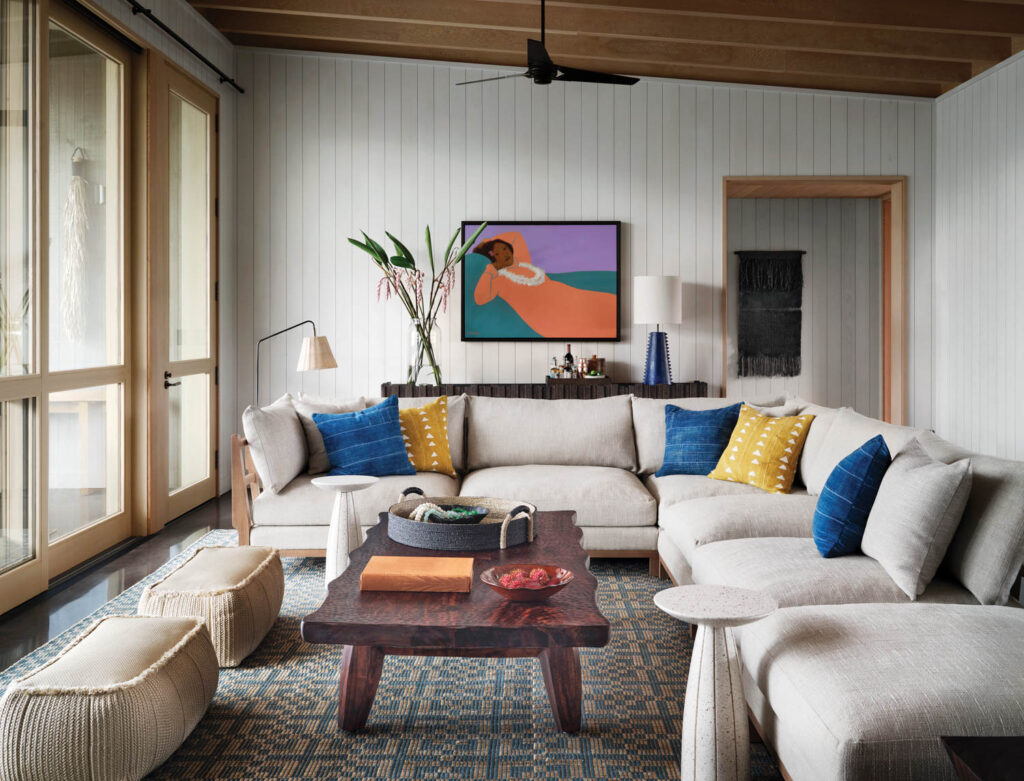 a living room in a suite at this resort with subtle pops of color accents