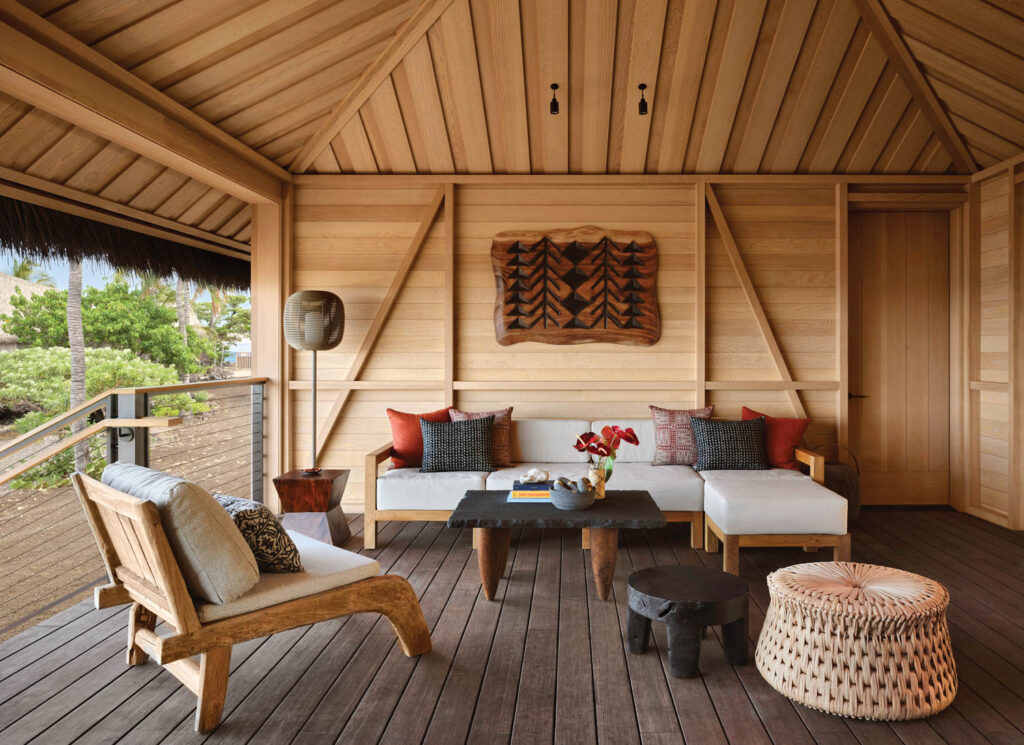 a furnished outdoor living room off the suite at a resort