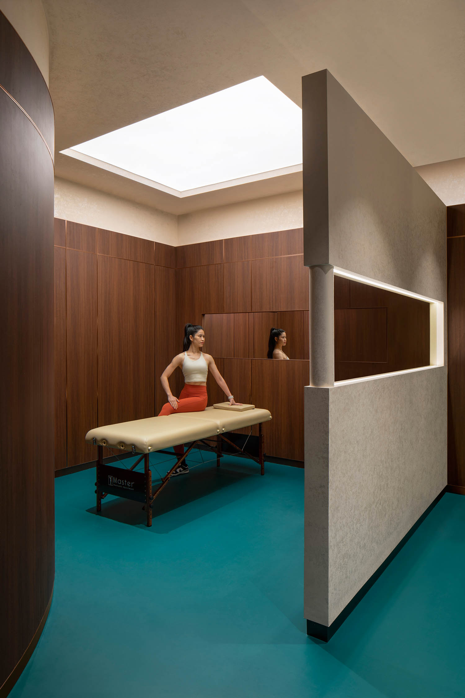 woman stretching in room with green carpeting