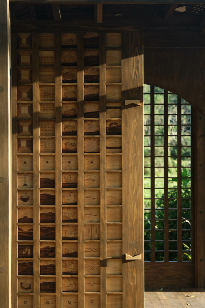 wooden barrier that separates two rooms from each other with view of the surrounding scenery