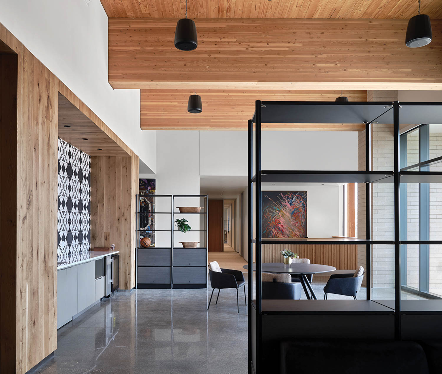 kitchen area with black shelves, seating area and separate nook