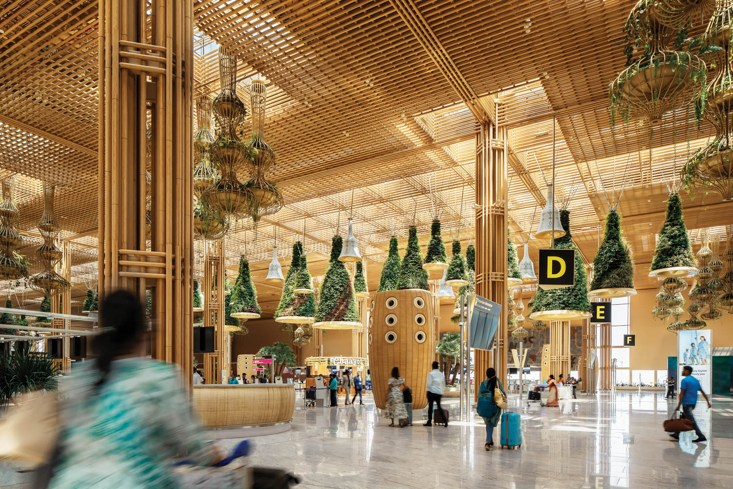 Verdant decorations and bell-like decorations inside of airport terminal