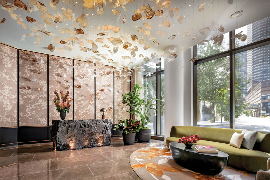 living room with chandelier with gold leaves and outdoor view