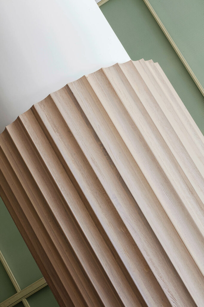 lobby with fluted columns in bleached white oak