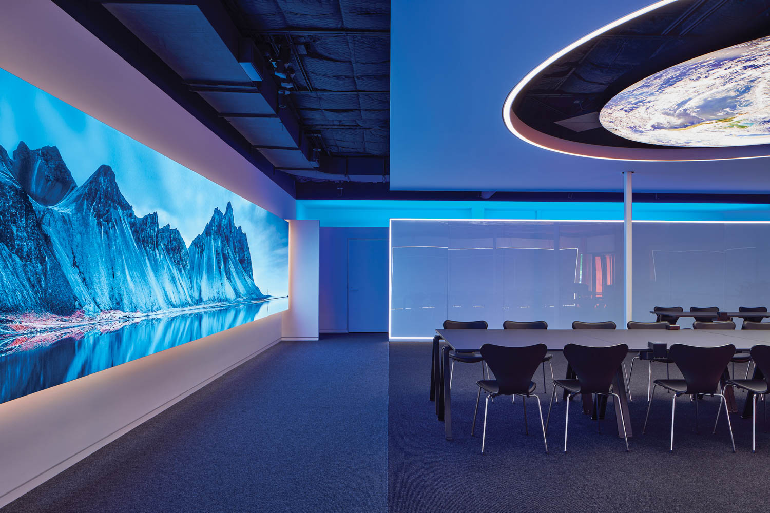 conference room with blue tinted screens and lights