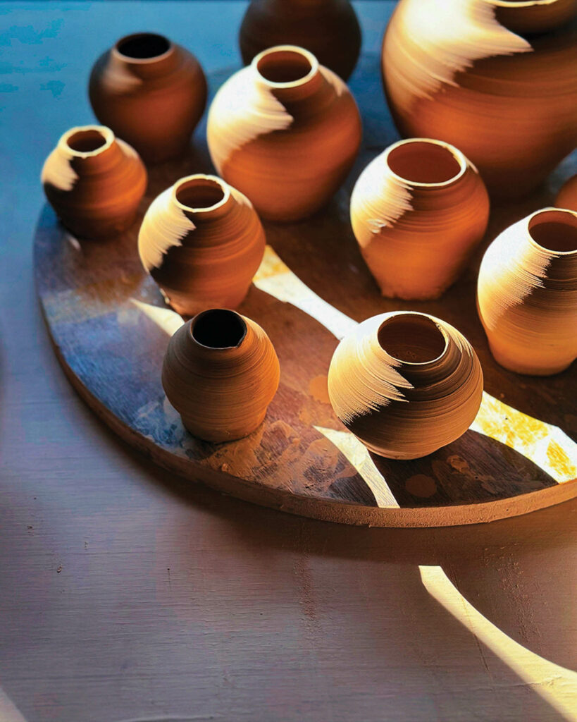 multiple earthen pots all gathered together