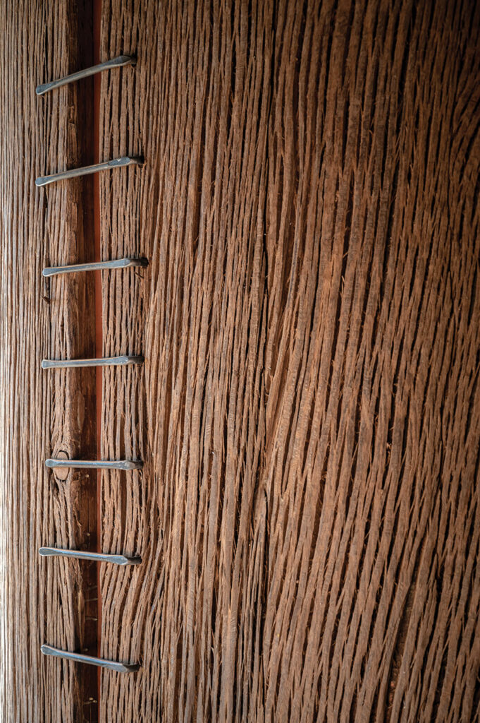 closeup of a concrete column wrapped in an oak veneer