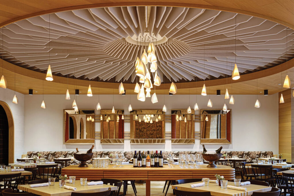 dining area punctuated by a bright chandelier