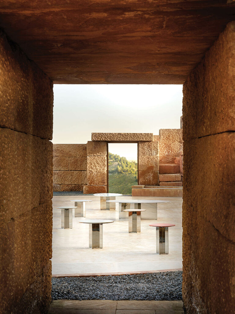 tunnel view of glass tables on a tile platform